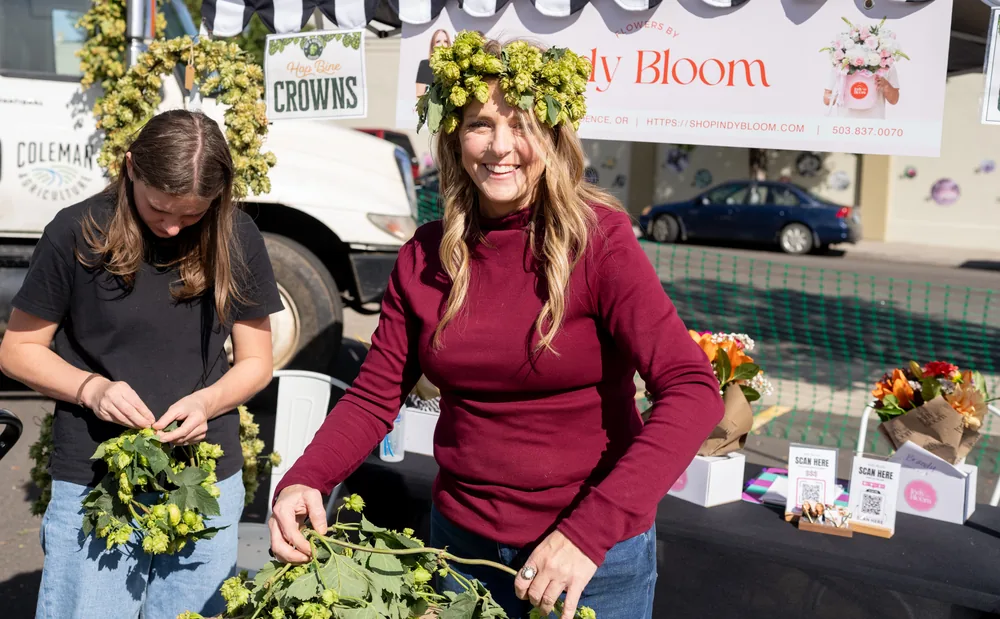 Vendors weaving fresh hop crowns at the Heritage Market on C Street